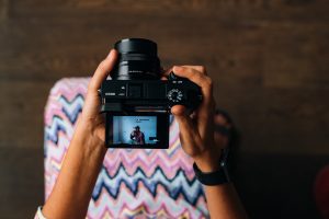 a girl holding a camera for resume formats