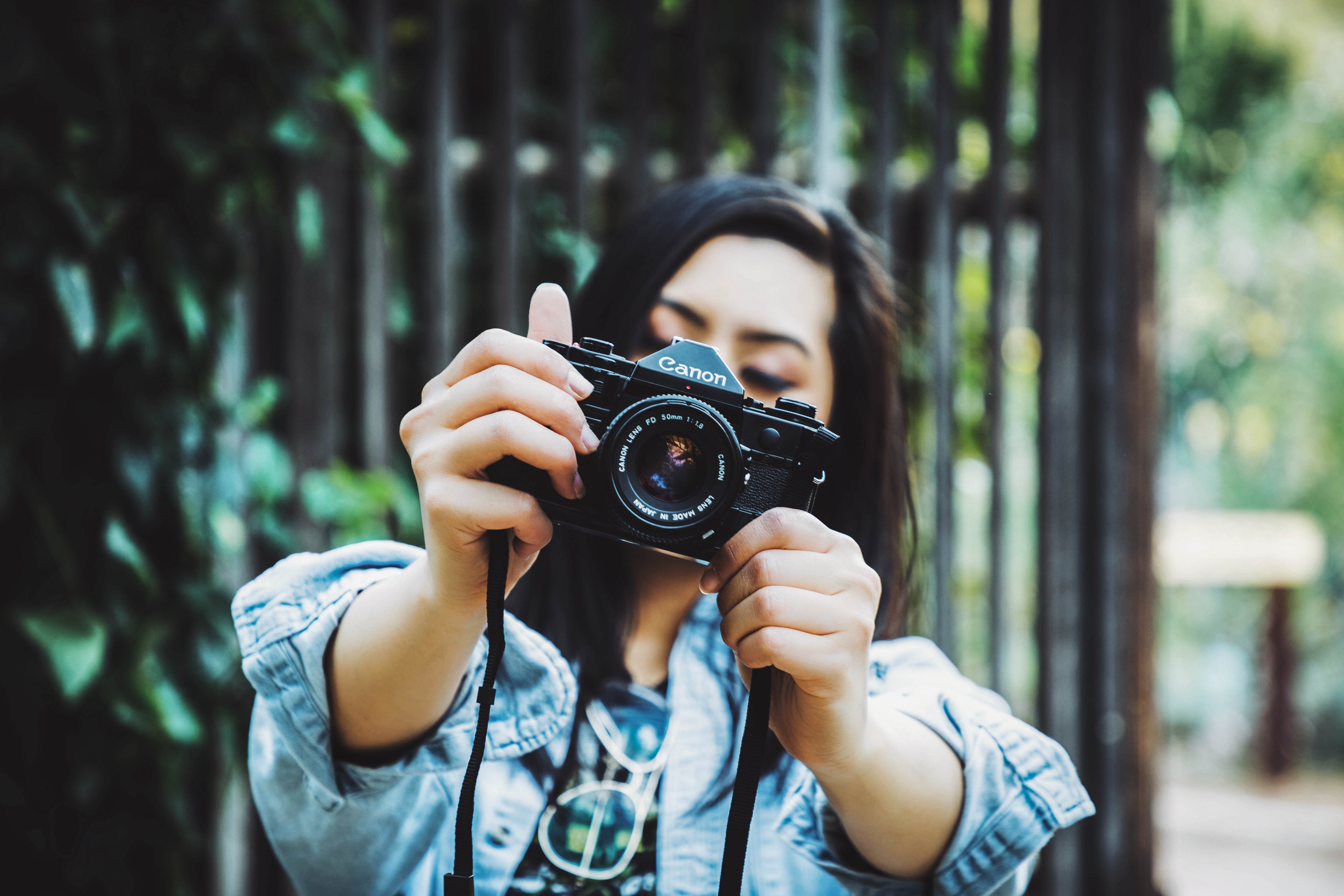 a man holding a camera taking a professional shot for resume formats