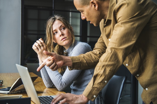 man giving tips to a girl about hiring resume writer