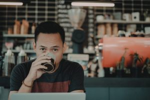 freelance jobs - man at work in a coffee shop