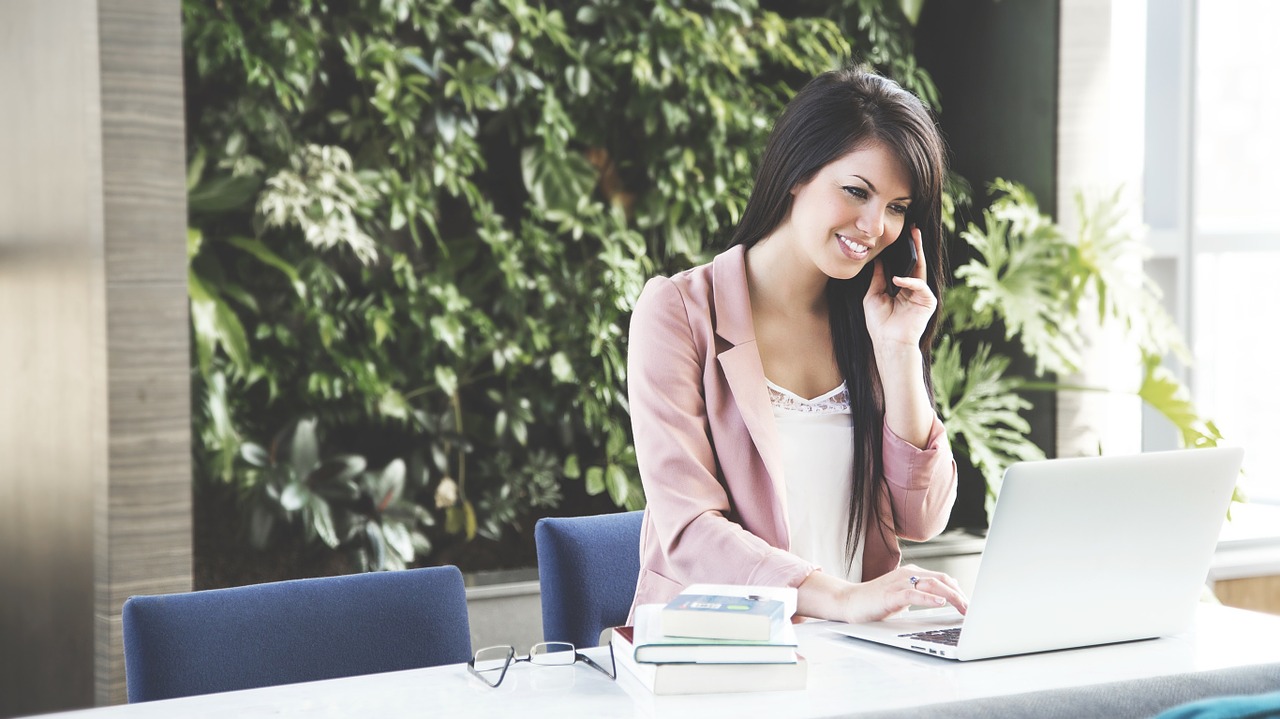 woman talking with certified resume writers on the phone