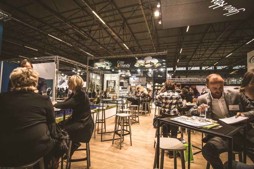 People networking in a cafe as result of linkedin profile writing tips