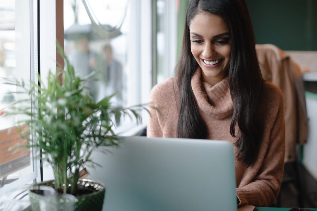 young woman working on her laptop